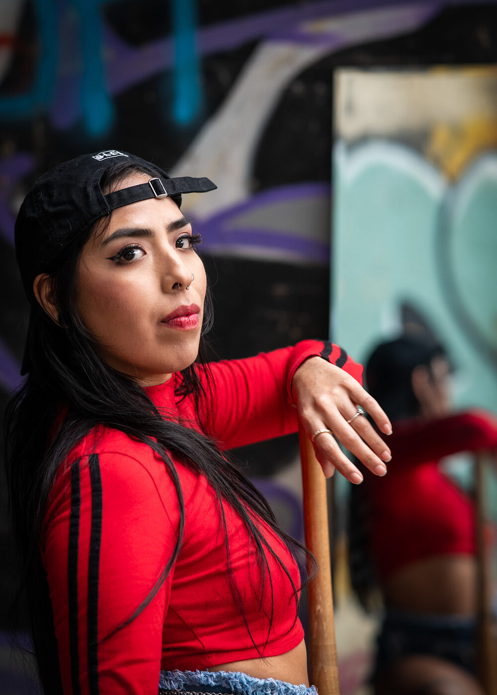Portrait in red against graffiti