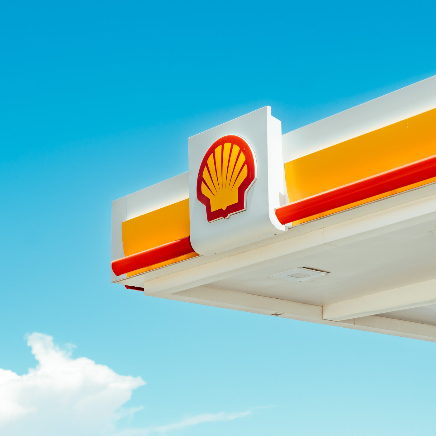 Shell station sign against open sky
